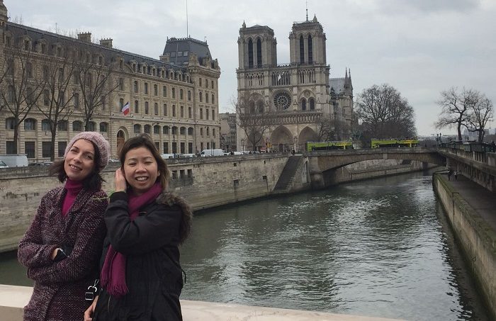 FilmDoo co-founder Weerada with a friend in front of Notre Dame in Paris